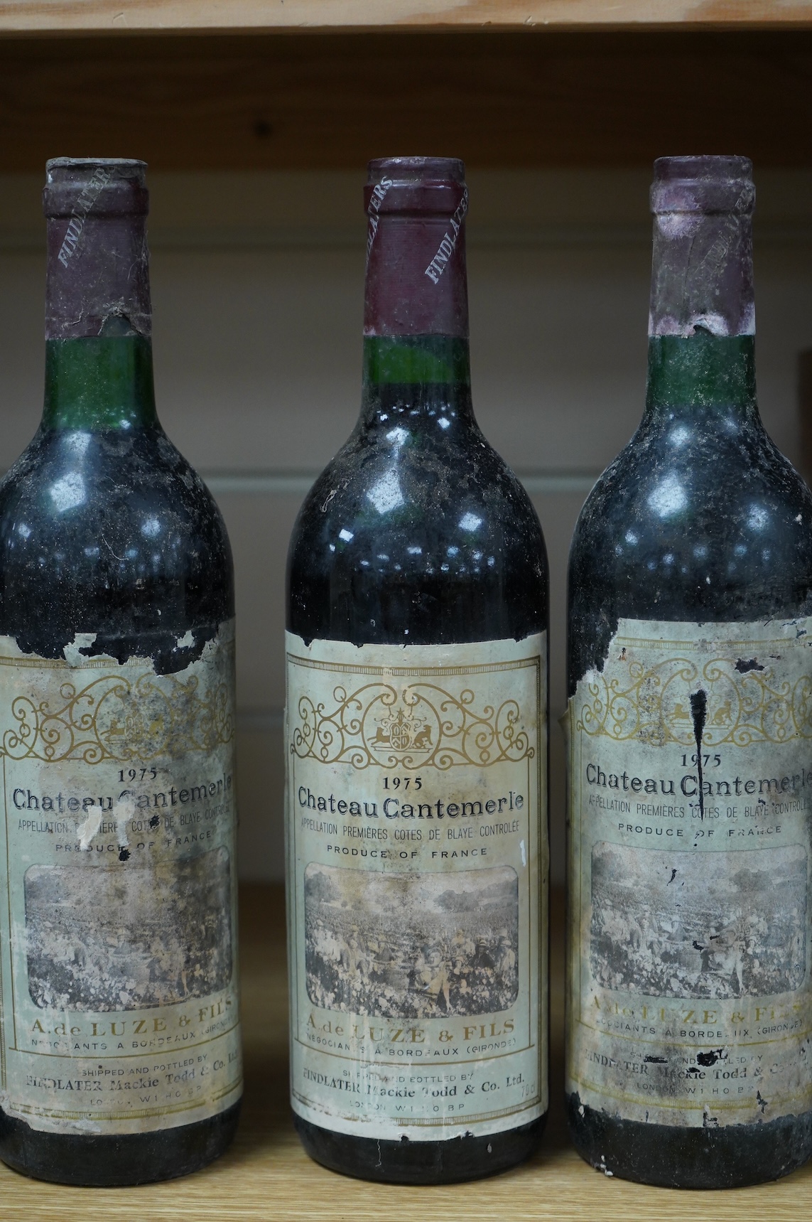 Five bottles of Chateau Cantemerle, 1975, labels degraded